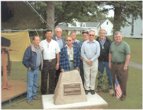 Some of the people who worked on the Andover Ground Station pose with the IEEE Milestone Plaque during the milestone dedication ceremony, 11 July 2002. (Courtesy of IEEE History Center.)