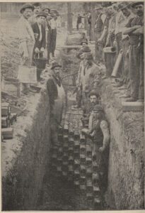 Laying a multiple-conduit 'subway' showing the different materials used and the amount of labor needed.